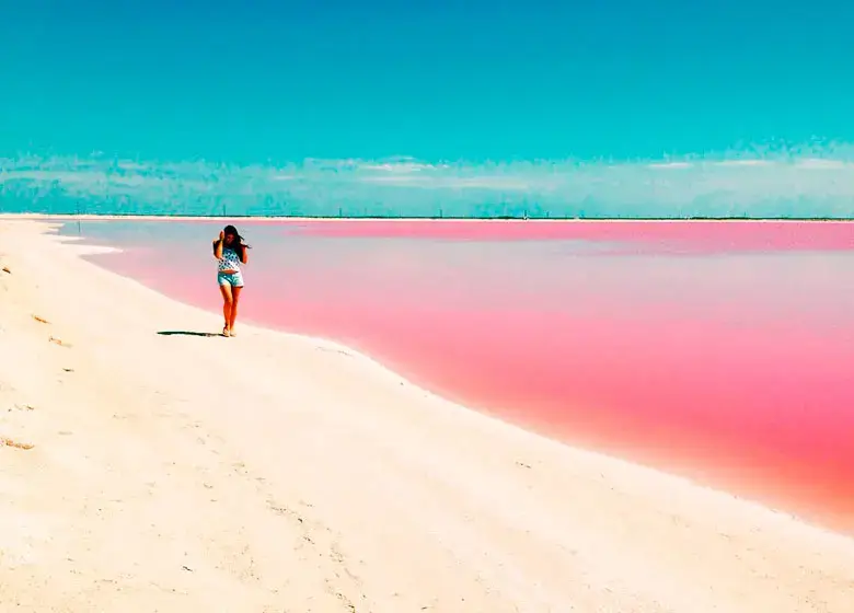 Girl with spacular background in the pink sea of Coloradas Yucatan
